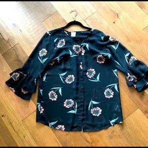 Sheer printed CAbi blouse with ruffled sleeves.